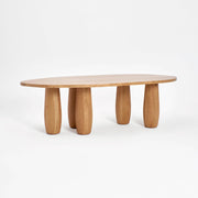 Asymmetric White Dining Table With Oval Legs