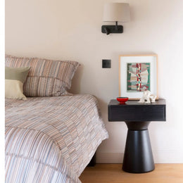 Small bedside table for compact bedroom spaces

