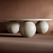 Round travertine coffee table in living room