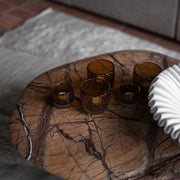 Brown marble coffee table with minimalist aesthetic

